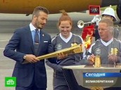 Дэвид Бэкхем усмирил стихию с Олимпийским огнем в руках